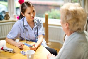 community nurse make a house call to senior