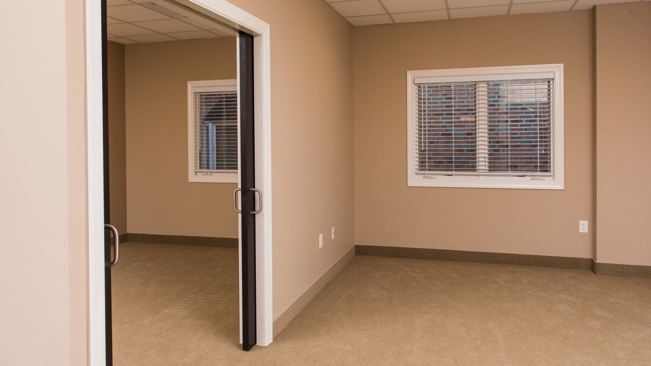 Door between bedroom and living area of one bedroom suite