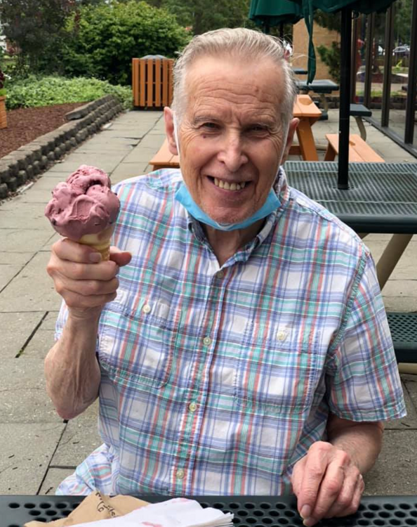 Senior man eating ice cream