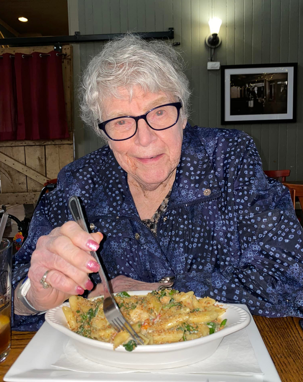 Senior woman eating at a restaurant