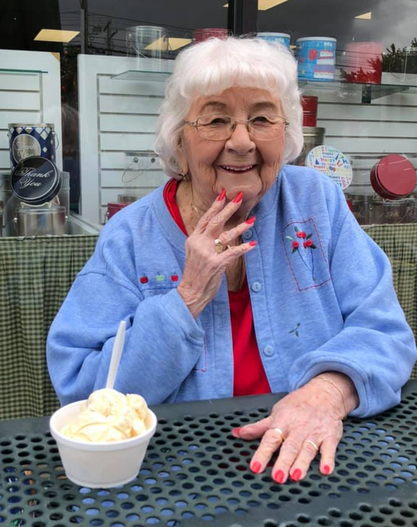 Senior woman eating ice cream