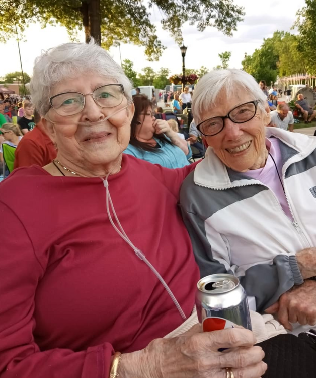 Two seniors at a concert