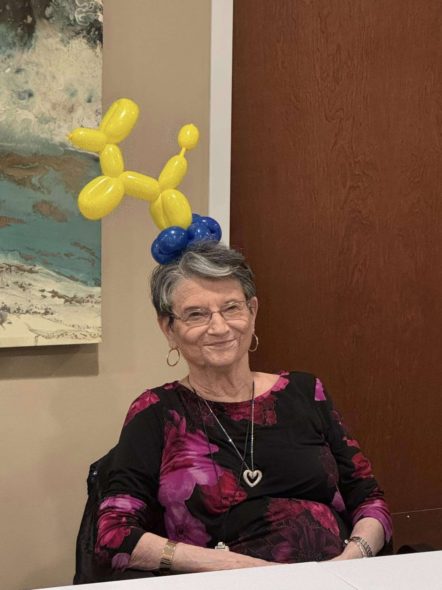 Woman wearing balloon animal hat