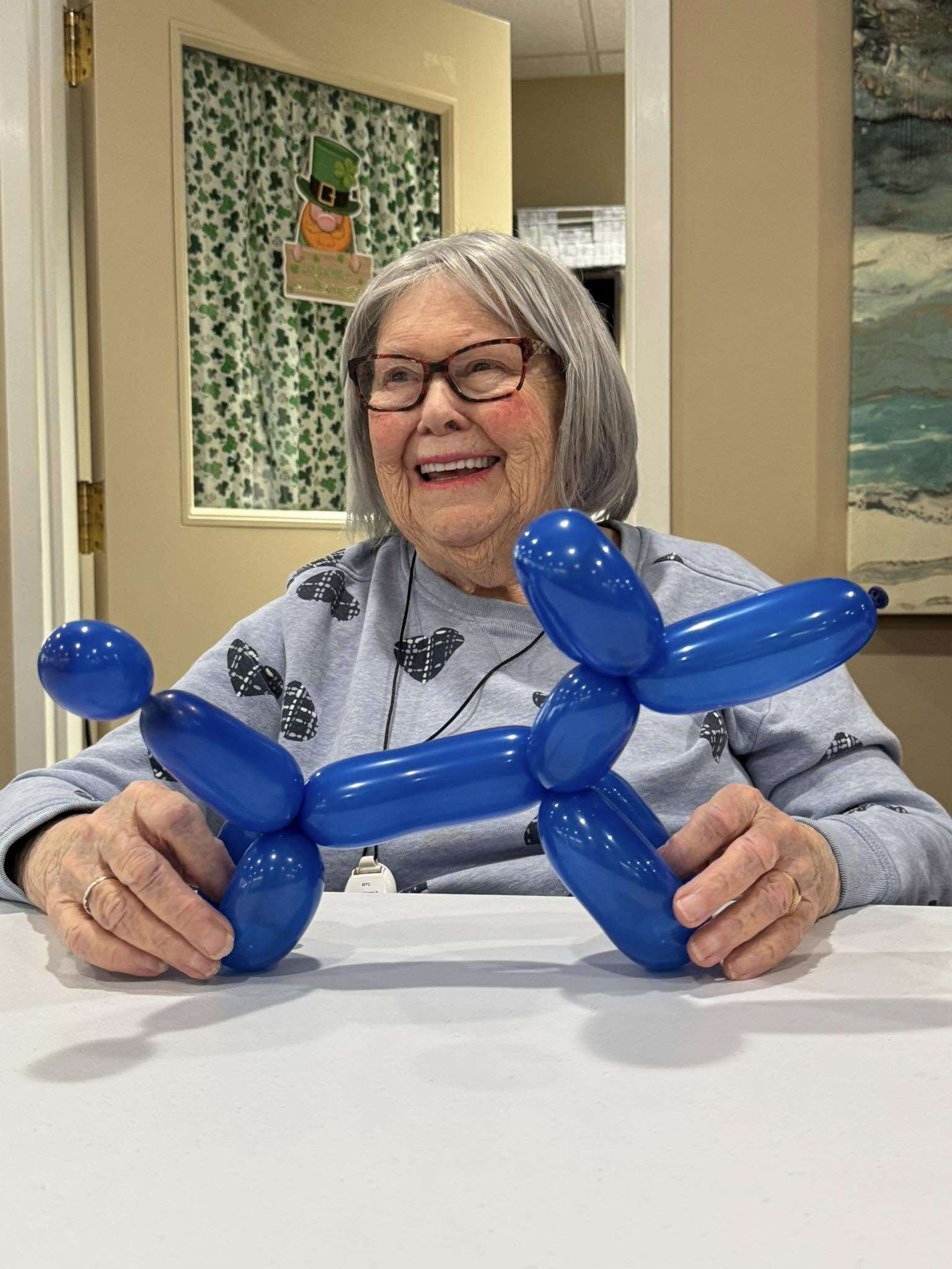 Woman with balloon animal dog